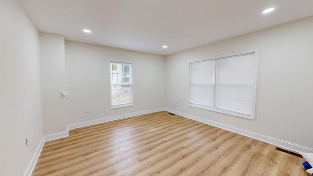 unfurnished room featuring light hardwood / wood-style flooring