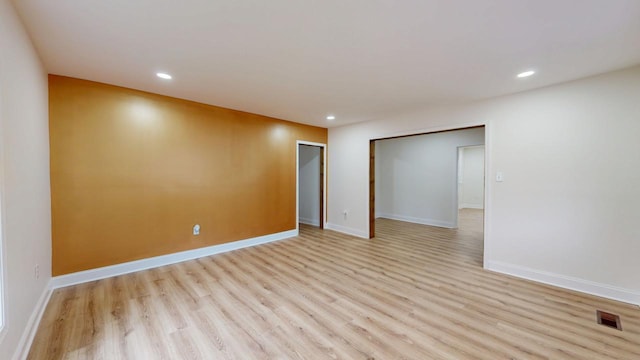 spare room with light hardwood / wood-style floors