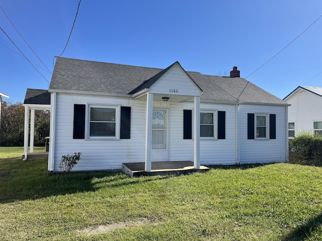 bungalow-style house featuring a front lawn