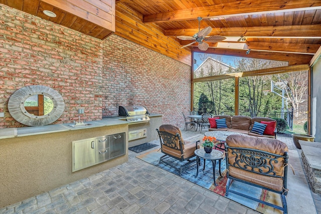 view of patio / terrace with an outdoor living space, area for grilling, and a ceiling fan