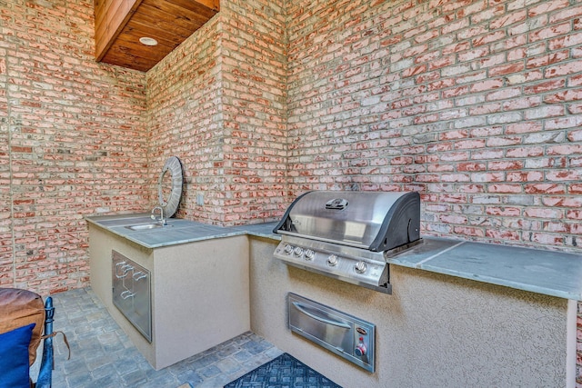 view of patio / terrace with a grill and an outdoor kitchen