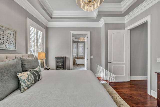 bedroom featuring dark wood finished floors, ornamental molding, multiple windows, and a chandelier