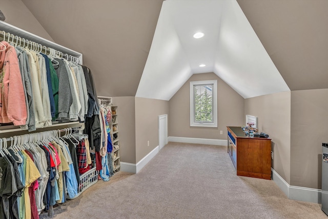 interior space featuring recessed lighting, baseboards, carpet, and lofted ceiling