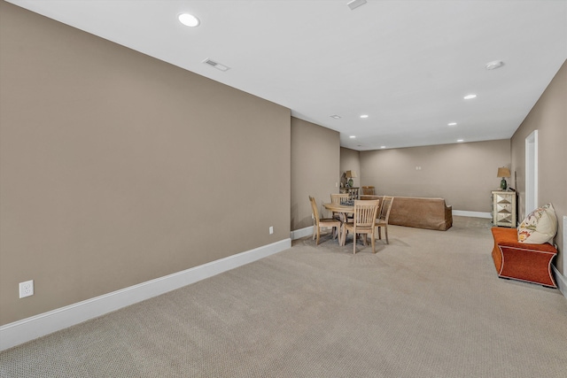 dining room featuring recessed lighting, visible vents, light carpet, and baseboards