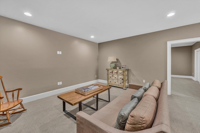 carpeted living room featuring recessed lighting and baseboards