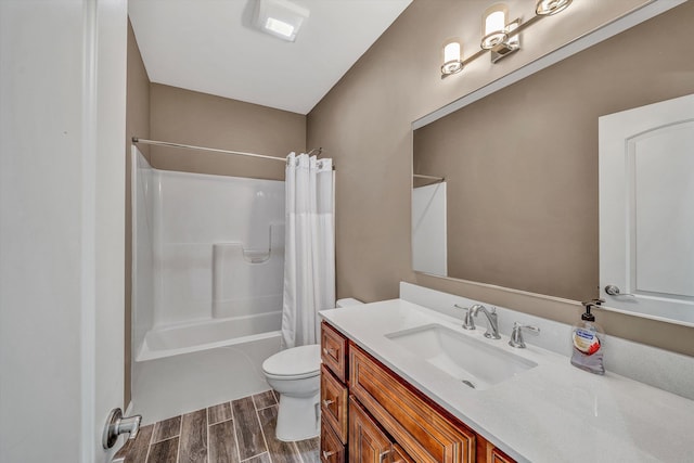 full bathroom featuring toilet, vanity, wood finish floors, and shower / bathtub combination with curtain