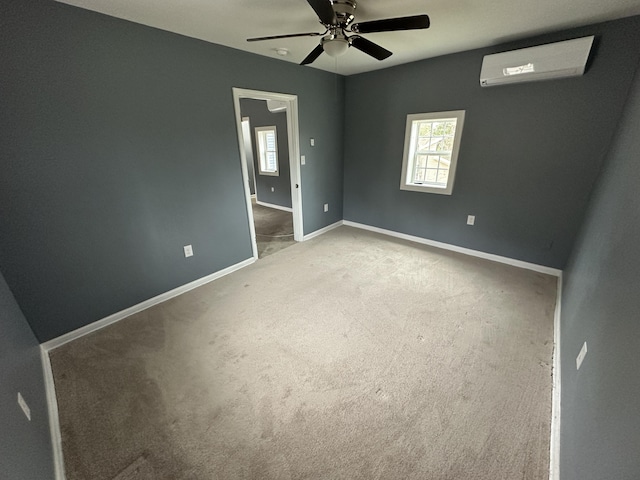 unfurnished bedroom with carpet floors, multiple windows, an AC wall unit, and ceiling fan