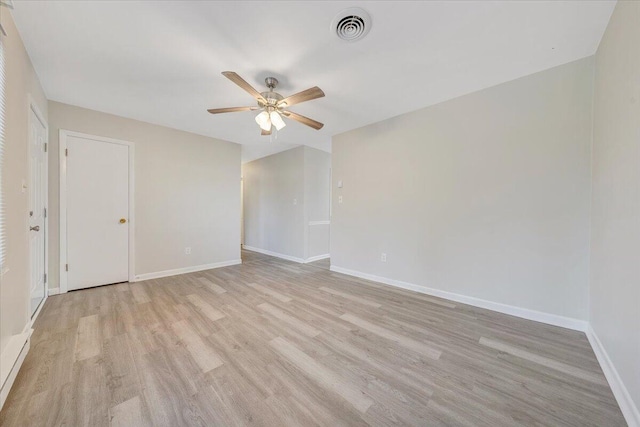 unfurnished room featuring ceiling fan and light hardwood / wood-style floors