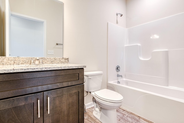 bathroom featuring shower / tub combination, toilet, vanity, and wood finished floors