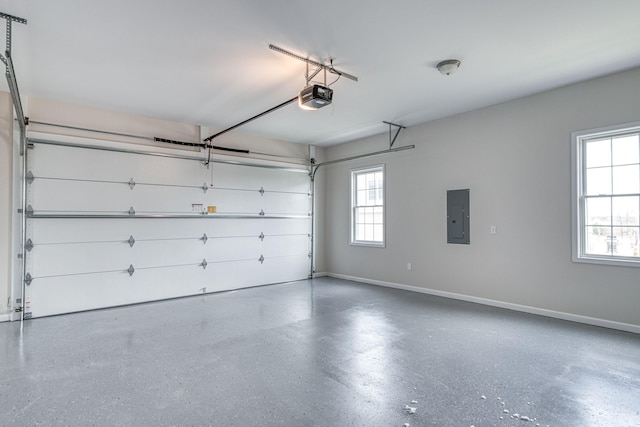 garage with electric panel, baseboards, and a garage door opener