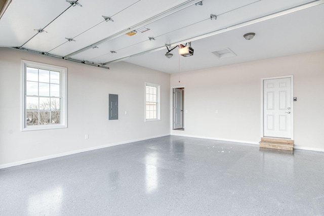 garage with electric panel, baseboards, and a garage door opener