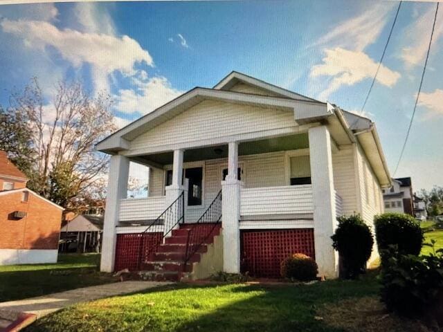 view of front of house with covered porch and stairs