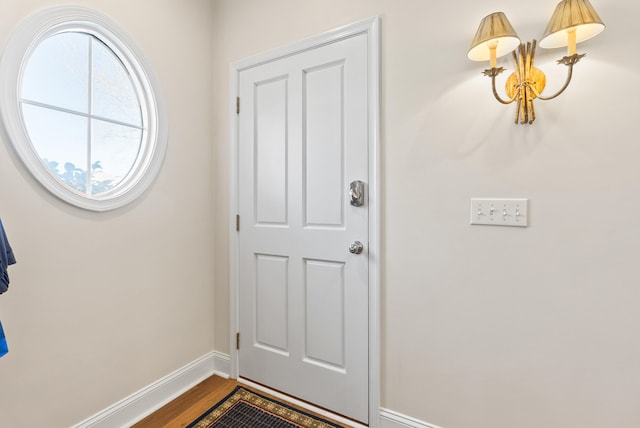 doorway with hardwood / wood-style floors