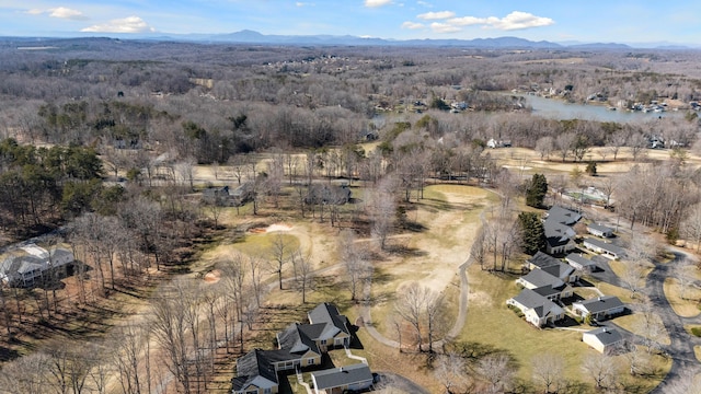 drone / aerial view with a water and mountain view