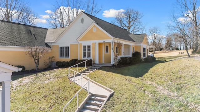 view of front of home featuring covered porch and a front yard