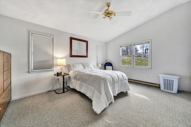 carpeted bedroom featuring ceiling fan, a baseboard heating unit, baseboards, and vaulted ceiling