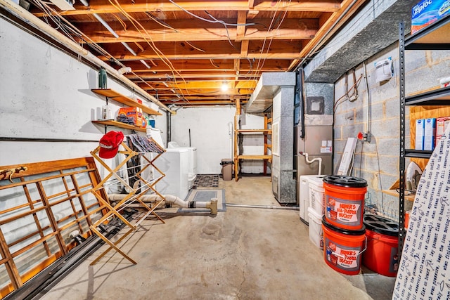 unfinished basement featuring independent washer and dryer