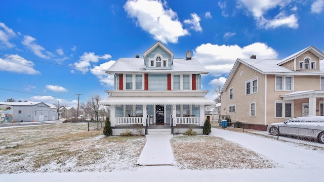 traditional style home featuring a porch and a residential view