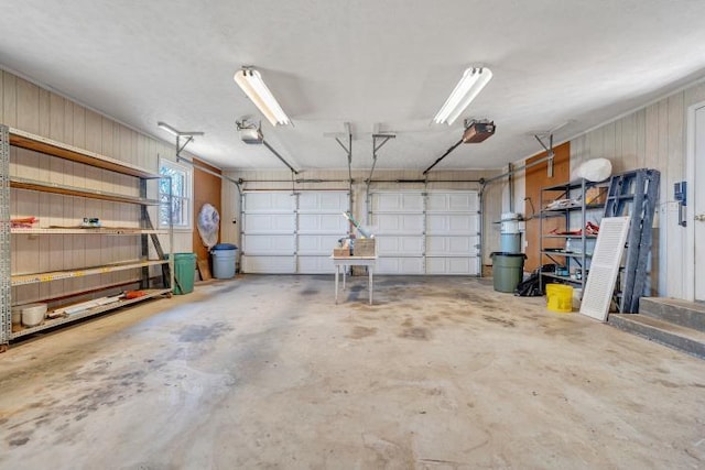 1345 Stone Mill Rd, Hurt, VA 24563 - garage with a garage door opener and wooden walls