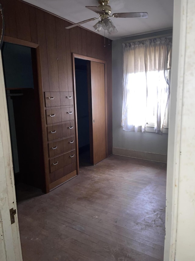 1345 Stone Mill Rd, Hurt, VA 24563 - unfurnished bedroom with wood finished floors, a closet, and a ceiling fan