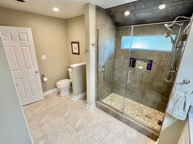 bathroom featuring a stall shower, baseboards, toilet, and recessed lighting