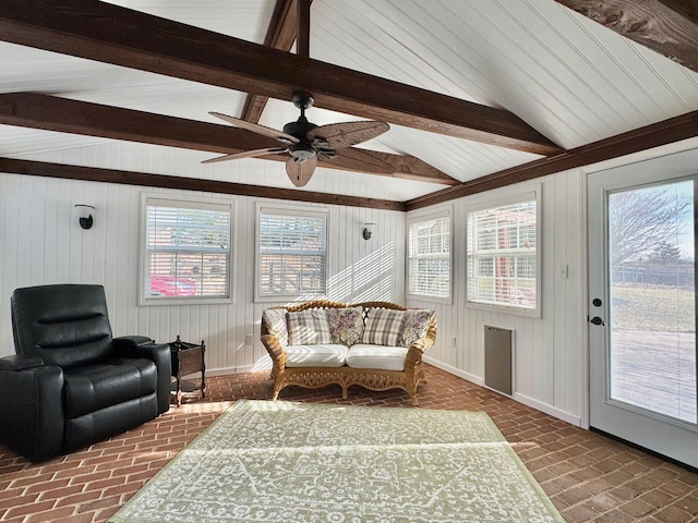 sunroom / solarium featuring vaulted ceiling with beams and ceiling fan