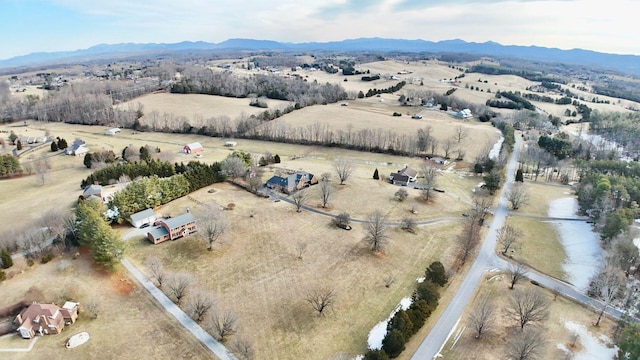 drone / aerial view with a mountain view and a rural view