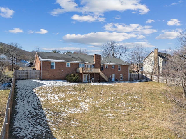 back of property featuring stairs, brick siding, a fenced backyard, and a wooden deck