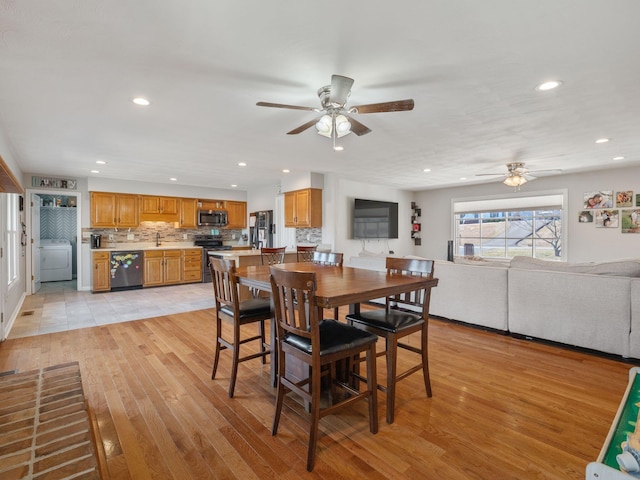 dining area featuring light wood finished floors, washer / clothes dryer, a ceiling fan, and recessed lighting