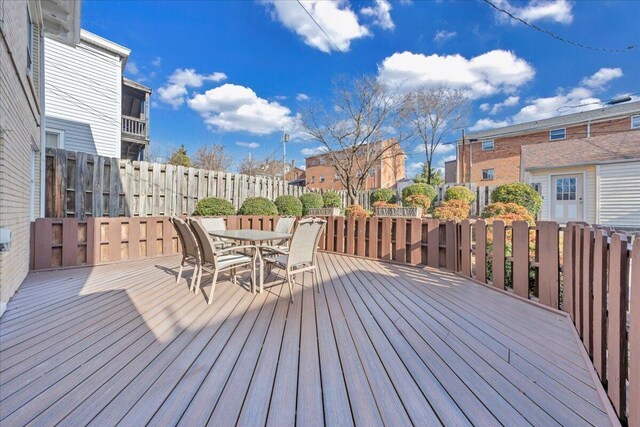 deck featuring fence and outdoor dining space