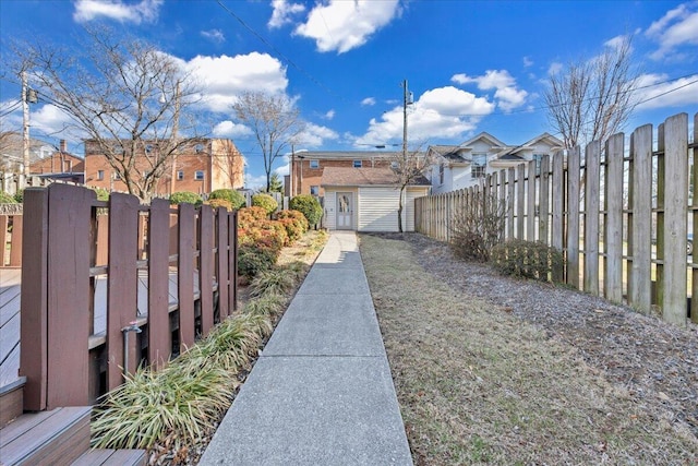 view of yard with a residential view and fence