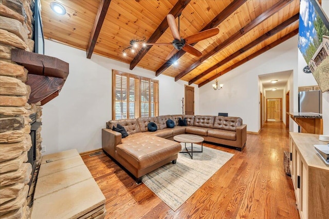 181 Borderline Rd NW, Willis, VA 24380 - living room featuring wood ceiling, light wood-style flooring, ceiling fan with notable chandelier, and beamed ceiling