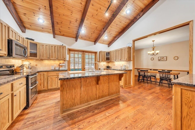 181 Borderline Rd NW, Willis, VA 24380 - kitchen featuring a sink, beam ceiling, appliances with stainless steel finishes, and light wood finished floors