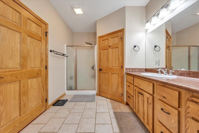 181 Borderline Rd NW, Willis, VA 24380 - bathroom with tile patterned flooring, a shower stall, vanity, and baseboards