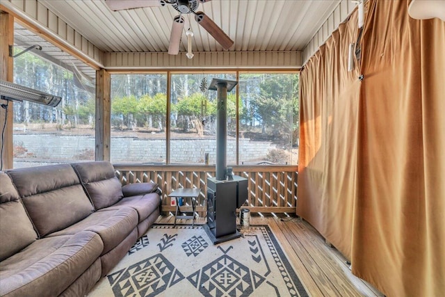 181 Borderline Rd NW, Willis, VA 24380 - sunroom featuring a wood stove and a ceiling fan