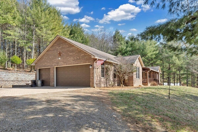 181 Borderline Rd NW, Willis, VA 24380 - view of front of property with a garage, a front yard, brick siding, and driveway