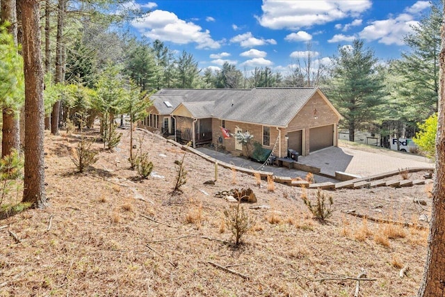 181 Borderline Rd NW, Willis, VA 24380 - exterior space featuring an attached garage, brick siding, and driveway