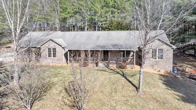 181 Borderline Rd NW, Willis, VA 24380 - ranch-style home featuring brick siding, a porch, and a front lawn