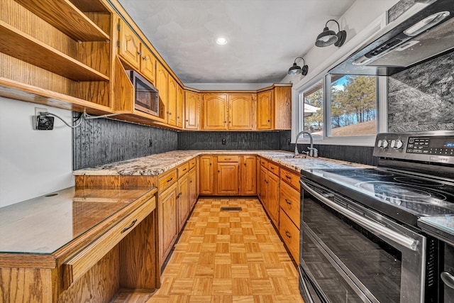 kitchen featuring range hood, open shelves, a sink, backsplash, and appliances with stainless steel finishes