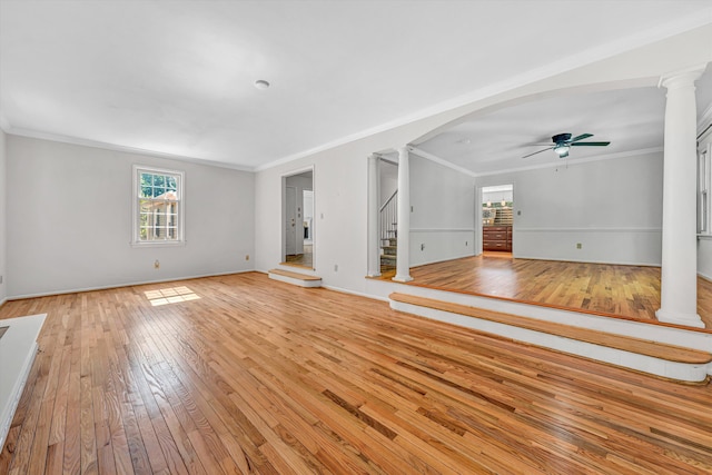 4937 Greenlee Rd SW, Roanoke, VA 24018 - unfurnished living room with decorative columns, ceiling fan, light wood-style flooring, stairs, and crown molding