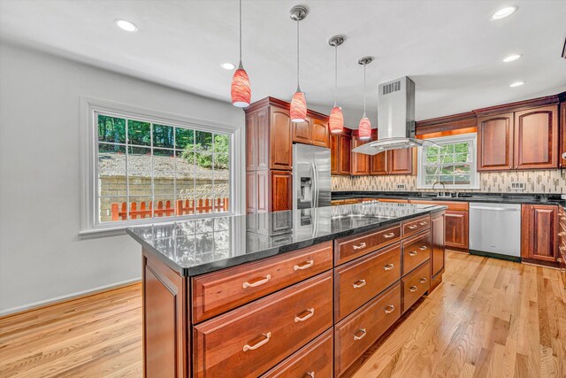 4937 Greenlee Rd SW, Roanoke, VA 24018 - kitchen with stainless steel appliances, island range hood, light wood-style flooring, a center island, and tasteful backsplash