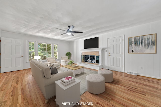 4937 Greenlee Rd SW, Roanoke, VA 24018 - living area with light wood-style flooring, a ceiling fan, and a high end fireplace