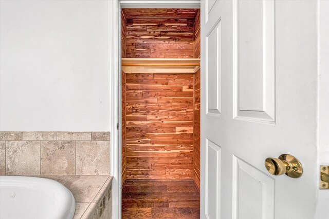 4937 Greenlee Rd SW, Roanoke, VA 24018 - bathroom featuring a jetted tub and wood finished floors