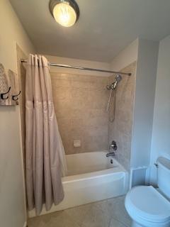 unfurnished bedroom with baseboards and wood finished floors