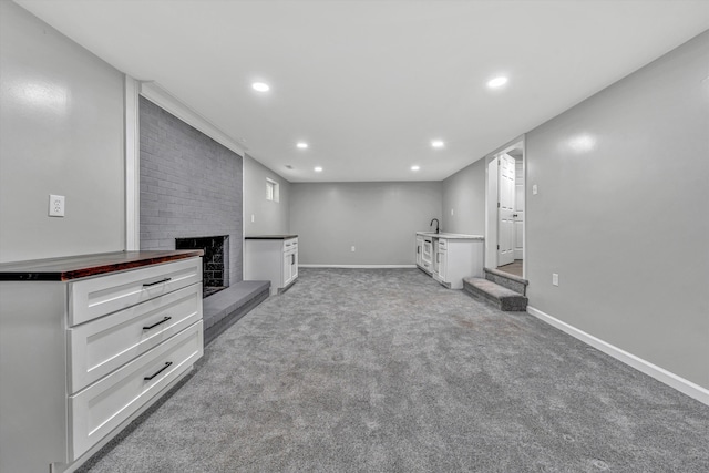 4937 Greenlee Rd SW, Roanoke, VA 24018 - unfurnished living room with a large fireplace, light carpet, and recessed lighting