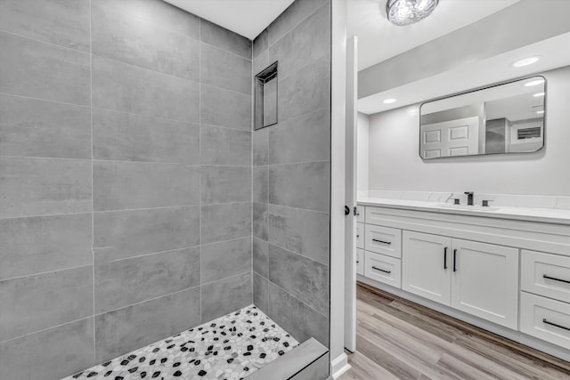 4937 Greenlee Rd SW, Roanoke, VA 24018 - full bathroom with vanity, tiled shower, wood finished floors, and recessed lighting