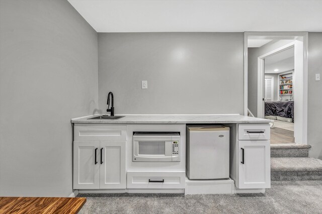 finished basement featuring recessed lighting, carpet, and baseboards