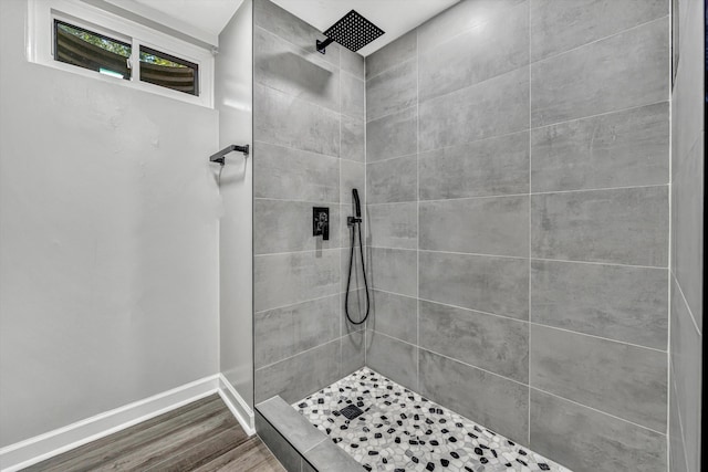 4937 Greenlee Rd SW, Roanoke, VA 24018 - bathroom featuring a tile shower and wood finished floors