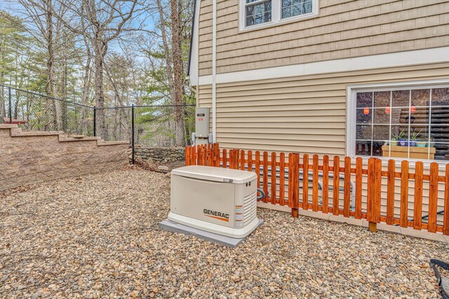 back of property with a chimney, a patio area, a gambrel roof, and a fenced backyard