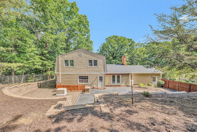 4937 Greenlee Rd SW, Roanoke, VA 24018 - rear view of property featuring a patio, a fenced backyard, french doors, and a chimney